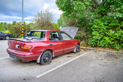 junk car in parking spot